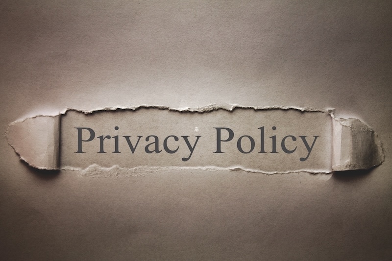 Privacy Policy word on the torn paper.