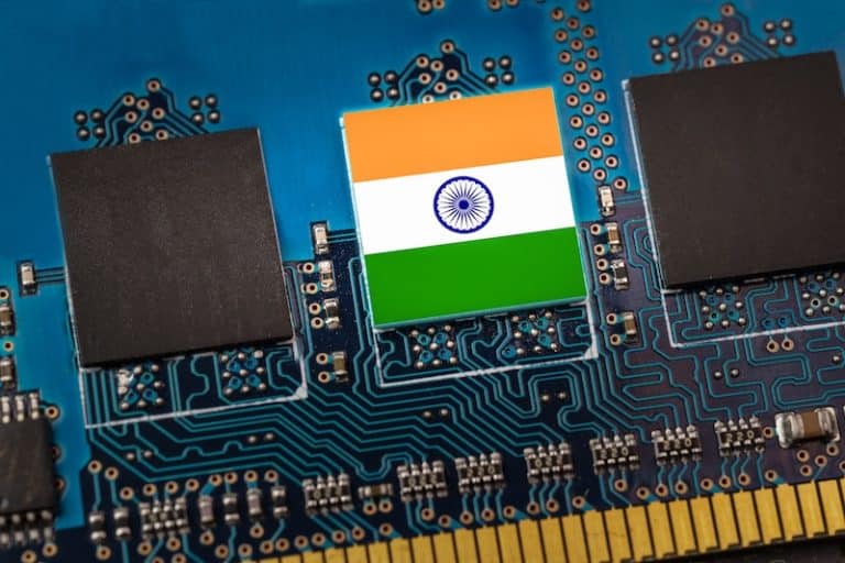 India Manufacturing Shift Indian flag in the center of a circuit board. Concept of leadership in technology, artificial intelligence or digital cryptocurrencies