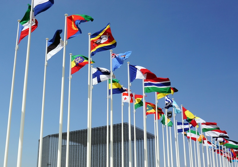 EU NATO partnership 2025 Flags on poles of the world